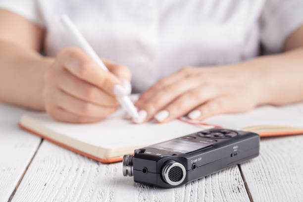 istock recording lecture on voice recorder instead of writing 1139846480