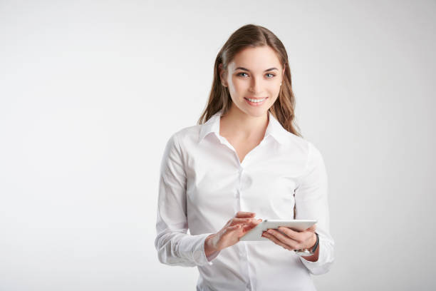 istock Young woman holding touchpad in her hand 1139847217
