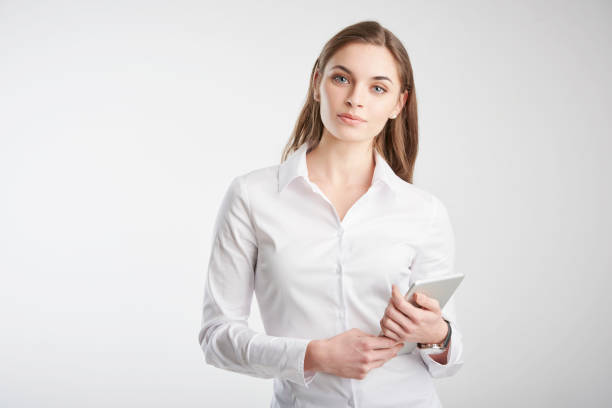 istock Young woman holding touchpad in her hand 1139847223