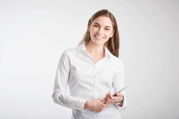 Young woman holding touchpad in her hand stock photo