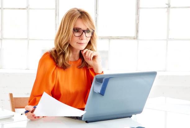 istock Thinking businesswoman working on notebook in the office 1139847308