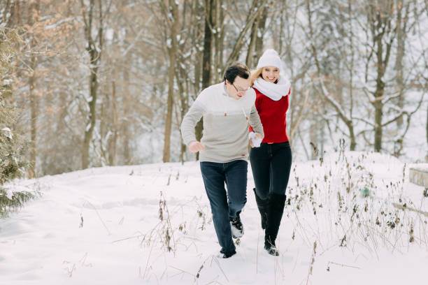 istock Happy Couple Having Fun Outdoors in Snow Park. Winter Vacation 1139847320