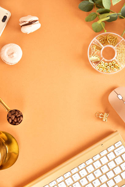 istock Flat lay. View from above. Business concept with a golden computer keyboard, macarons, a cup of coffee. Place for text. 1139847344
