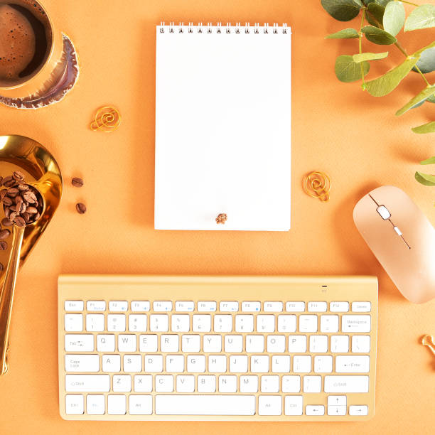 istock Flat lay. View from above. Business concept with a golden computer keyboard, macarons, a cup of coffee. Place for text. 1139847395