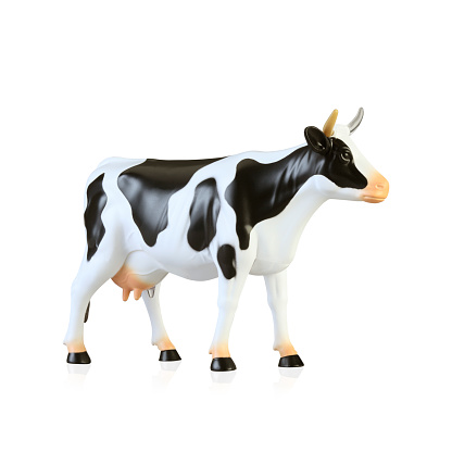 Animal plastic cow toy isolated on white background