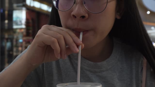 Woman drink Cup of Cola