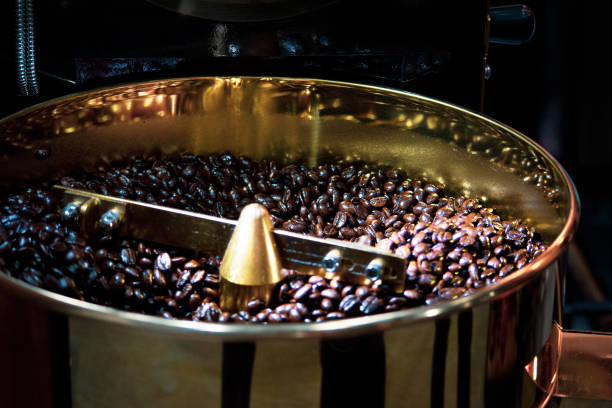 istock Roasted coffee in coffee roaster, Machine for roasting coffee bean roasting close up 1139855095