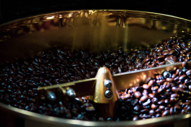 istock Roasted coffee in coffee roaster, Machine for roasting coffee bean roasting close up 1139855103