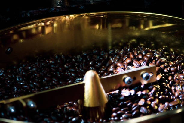 istock Roasted coffee in coffee roaster, Machine for roasting coffee bean roasting close up 1139855110