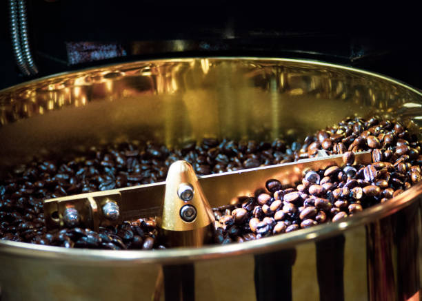 istock Roasted coffee in coffee roaster, Machine for roasting coffee bean roasting close up 1139855129
