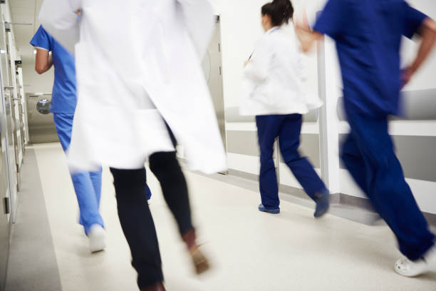 istock Blurred view of doctors running in a hurry 1139855512