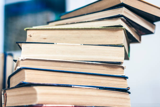 istock Stack of books education background, many books piles with copy space for text 1139858329