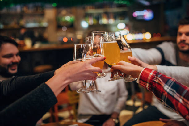 istock Friends drinking beer in pub 1139860699