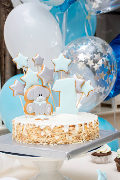 istock cake for a boy's first birthday with gingerbread bear, stars, number one 1139860876