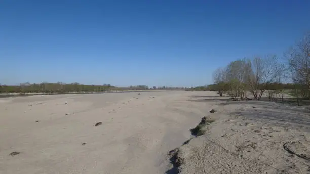River Po - Pavia - Lombardia - Italy - March 26, 2019. The dry Po river bank at its lowest water level.
