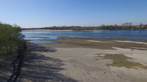 River Po - Italy River Po - Pavia - Lombardia - Italy - March 26, 2019. The dry Po river bank at its lowest water level. drought stock pictures, royalty-free photos & images