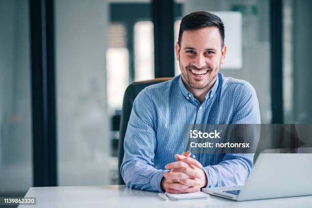 Portrait Of A Smiling Entrepreneur Or Businessman At Office Desk Stock Photo - Download Image Now