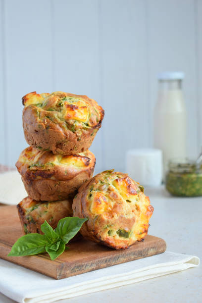 freshly baked muffins with spinach, sweet potatoes and feta cheese on white background. healthy food concept. savory pastry. - muffin cheese bakery breakfast imagens e fotografias de stock