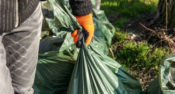 istock man picking up trash cleaning in the street 1139866552