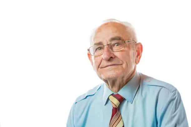 Portrait of 90 year old senior man in glaases looking at camera isolated on white background