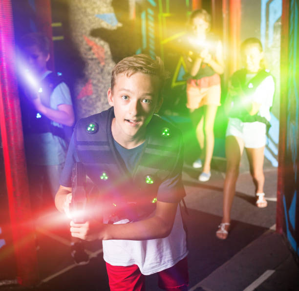 istock Boy having fun on lasertag arena 1139868130