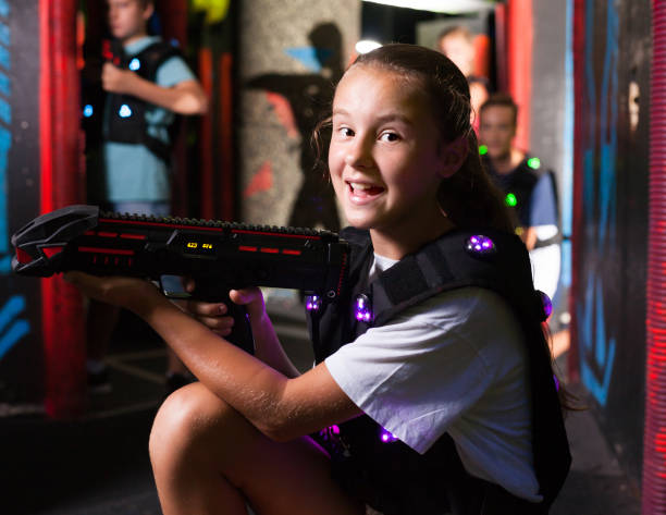 istock Girl having fun on lasertag arena 1139868134