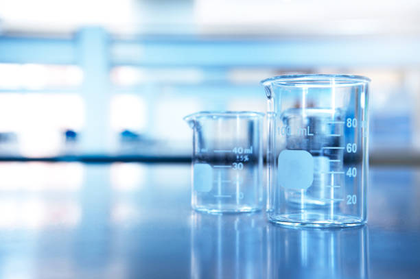 istock two glass beaker on chemistry science laboratory table blue research and education background 1139868160