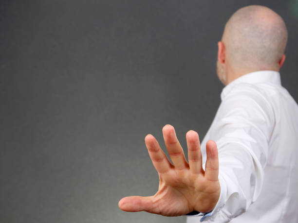 istock the negative gesture of men turned aside 1139871141