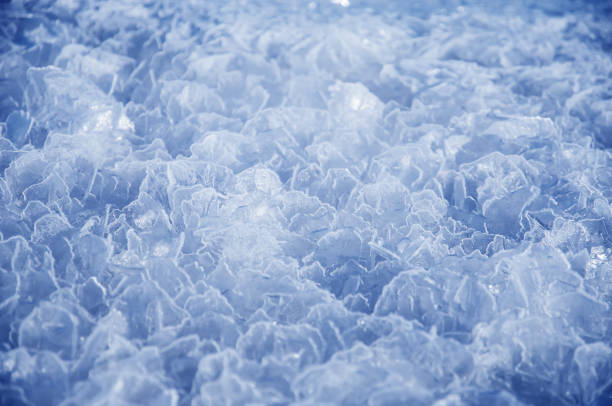 istock Water frozen in ice macro background of solid crystals. 1139872021