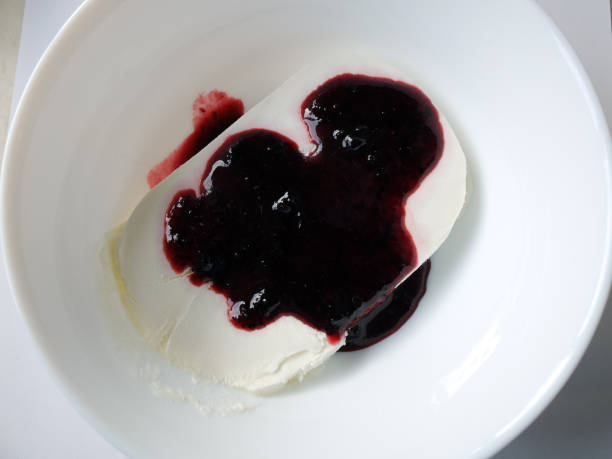 istock Plate of white ice cream drenched jam. 1139872108