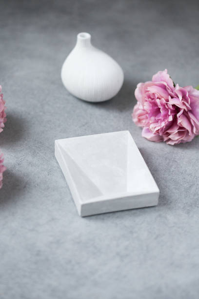 istock Mock up composition: concrete table, flowers, and vase 1139873426