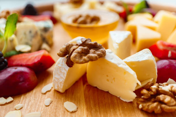 istock Camembert slices with grapes, walnuts and honey 1139873464