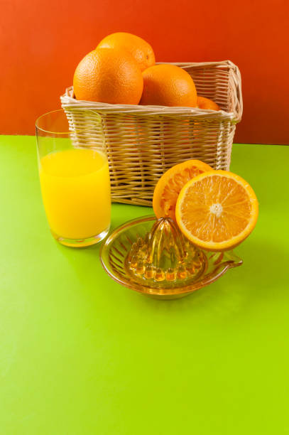 istock manual juicer with basket orange 1139874133