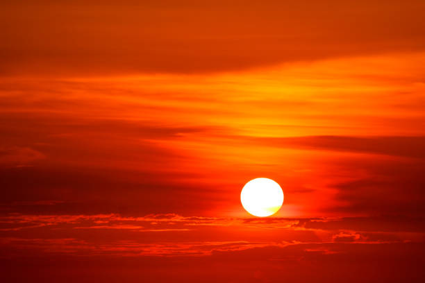 istock last light of sunset on sky and silhouette red cloud 1139874420