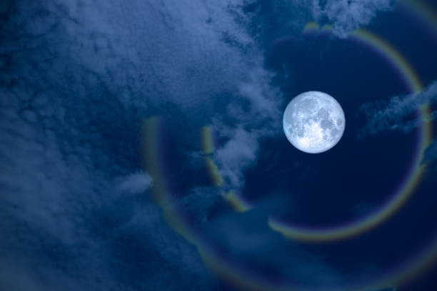 istock full flower halo moon and rainbow on night sky 1139875920
