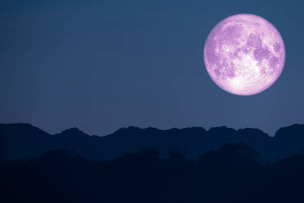 istock super flower pink moon back on silhouette mountain on night sky 1139875948