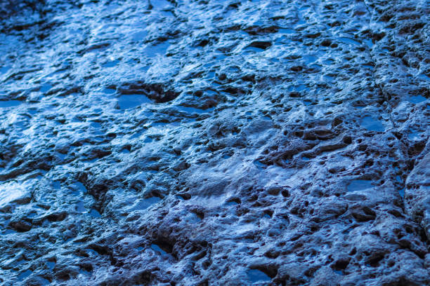 istock Abstract texture surface of a rock with water. 1139877290