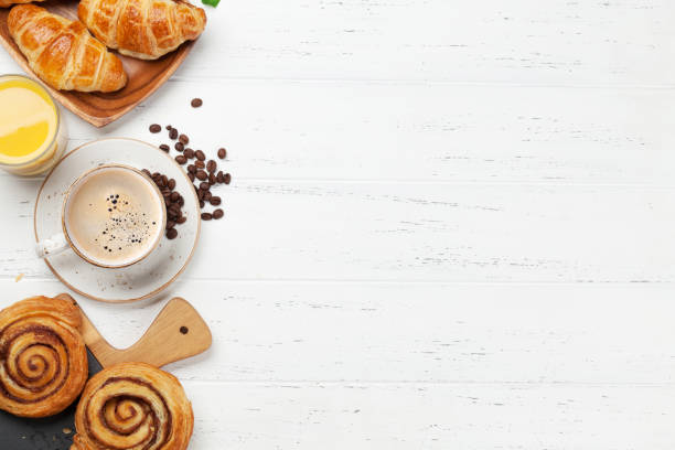 coffee, juice and croissants breakfast - pastry imagens e fotografias de stock