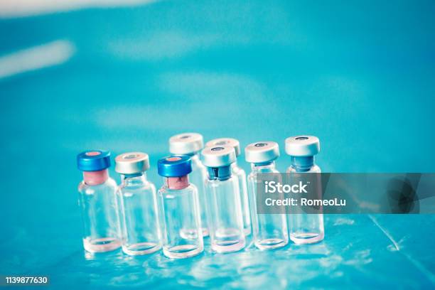 Infant And Childhood Vaccines Bottles Vaccines Immunization Concept Stock Photo - Download Image Now