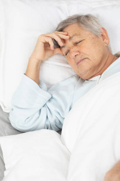 istock Sleeping Senior Woman 1139878380