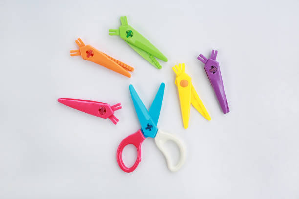 istock Creative plastic children safety scissors set on white background. 1139878527