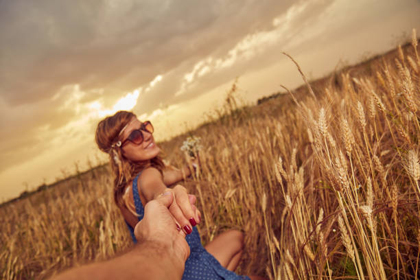 istock Young couple enjoying in a wheat field. 1139878536