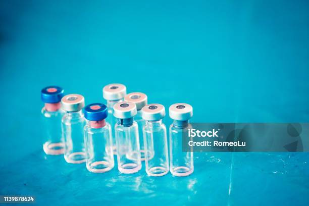 Infant And Childhood Vaccines Bottles Vaccines Immunization Concept Stock Photo - Download Image Now