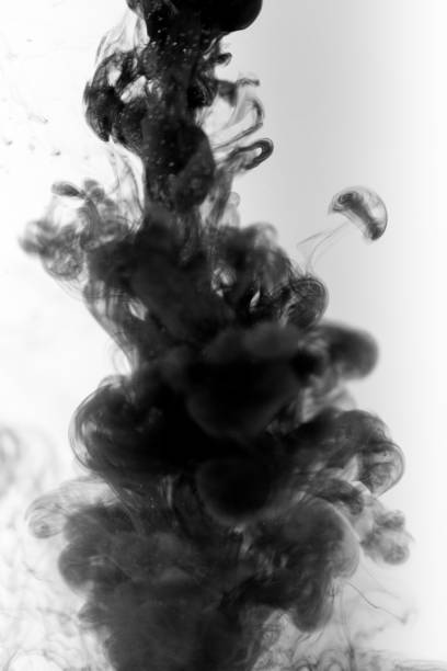 istock Black paint ink in water on white background 1139881578