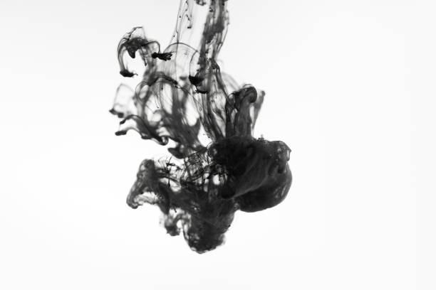 istock Black paint ink in water on white background 1139881594