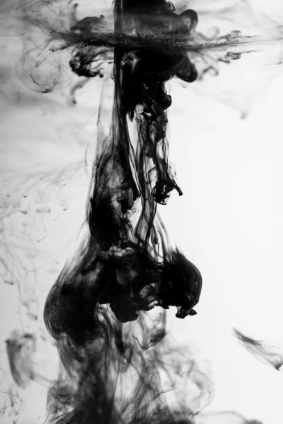 istock Black paint ink in water on white background 1139881644