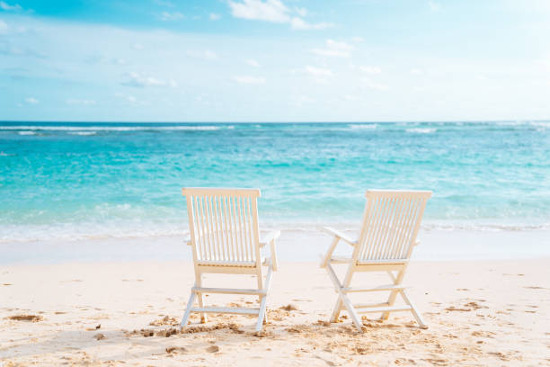 istock Bali, Bukit. Two white chairs on the beach 1139881681
