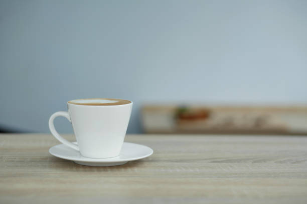 istock white cup of coffee on wooden table 1139882487