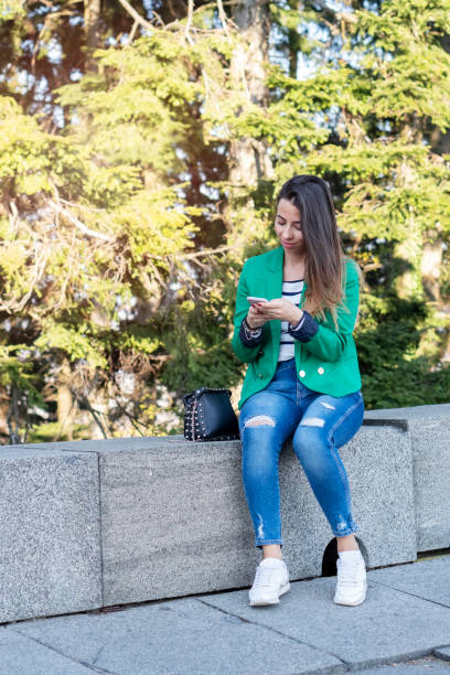 istock Women using phone outdoors 1139882505
