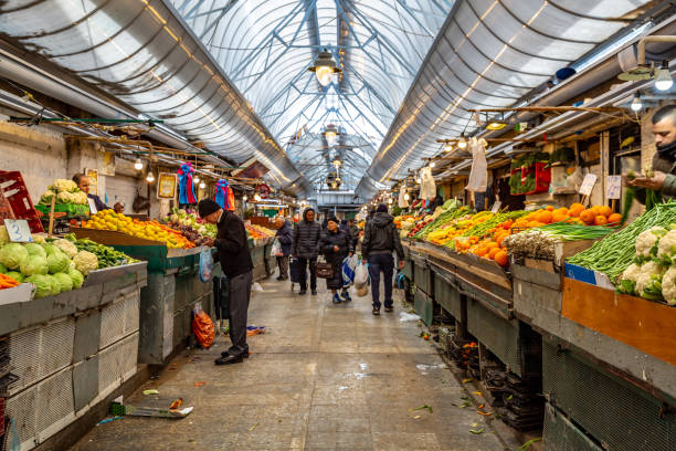 People shopping at Mahane Yehuda Jerusalem market, Israel. This pic shows People shopping at Mahane Yehuda Jerusalem marke. The Mahane Yehuda market is the best place to choose fresh and tasty fruits and vegetables,its a very popular place among locals. The pic is taken in january 2019. hasidism photos stock pictures, royalty-free photos & images